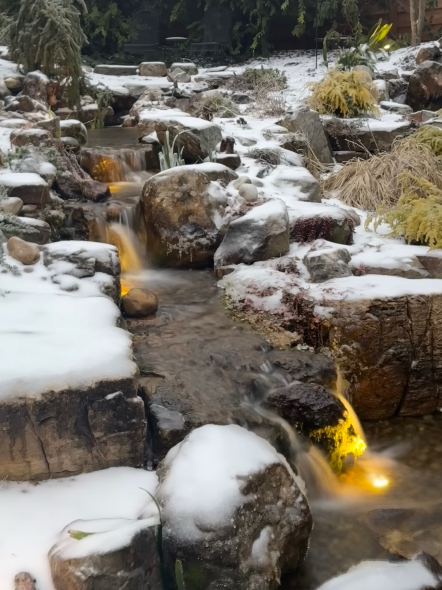Golden-lit waterfall, The Resort